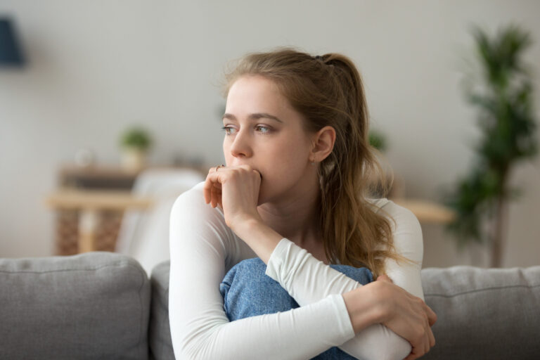 A women thinking of Pregnancy Signs and Symptoms 2