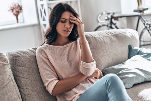 A women thinking of Pregnancy Signs and Symptoms 3