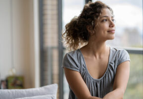 A women thinking of Pregnancy Signs and Symptoms